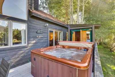 a hot tub sitting outside of a house at 11 Mi to Slopes Frisco Home with Hot Tub and Sauna! in Frisco