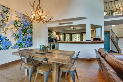 a dining room with a wooden table and chairs at 11 Mi to Slopes Frisco Home with Hot Tub and Sauna! in Frisco