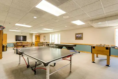 a ping pong room with a ping pong table at Winter Park Ski-InandSki-Out Condo with Mountain Views in Winter Park