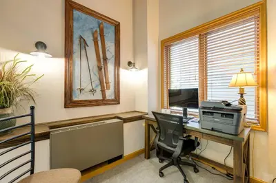 an office with a desk with a printer and a computer at Winter Park Ski-InandSki-Out Condo with Mountain Views in Winter Park