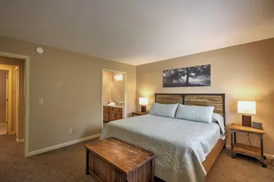 a bedroom with a large bed and a table at Half-Mi to Copper Mtn Slopes Frisco Unit with Loft in Frisco