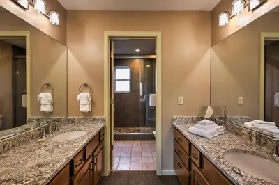a bathroom with two sinks and a shower at Half-Mi to Copper Mtn Slopes Frisco Unit with Loft in Frisco
