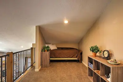 a bedroom with a bed in a attic at Half-Mi to Copper Mtn Slopes Frisco Unit with Loft in Frisco