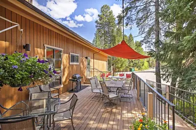 a deck with chairs and a table and a grill at Winter Park Condo with Hot Tubs, 4 Mi to Ski Resort! in Winter Park