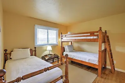 a bedroom with two bunk beds and a window at 7 Mi to Slopes! Mtn-View Silverthorne Resort Hub in Silverthorne