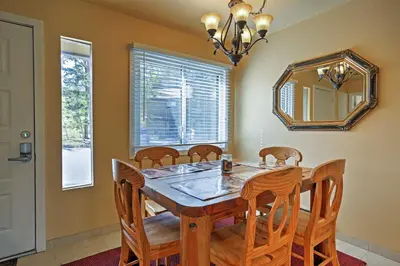 a dining room with a table and chairs and a mirror at 7 Mi to Slopes! Mtn-View Silverthorne Resort Hub in Silverthorne