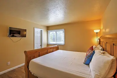 a bedroom with a bed and a window at 7 Mi to Slopes! Mtn-View Silverthorne Resort Hub in Silverthorne