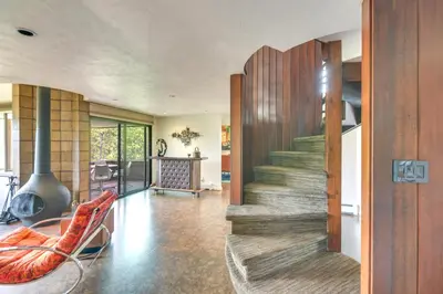 a living room with a staircase in a house at Boulder Barrett House on Mtn Peak with Hot Tub in Boulder