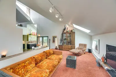 a living room with a couch and a tv at Boulder Barrett House on Mtn Peak with Hot Tub in Boulder