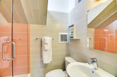 a bathroom with a sink and a toilet and a shower at Boulder Barrett House on Mtn Peak with Hot Tub in Boulder