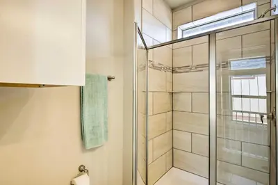 a bathroom with a shower with a glass door at 4 Mi to Granby Ranch Home with Mtn Views in Granby