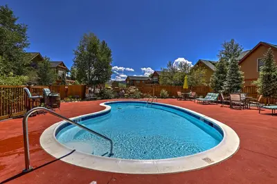 a small swimming pool in a yard with tables and chairs at 4 Mi to Granby Ranch Home with Mtn Views in Granby