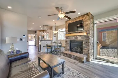 a living room with a couch and a fireplace at 4 Mi to Granby Ranch Home with Mtn Views in Granby