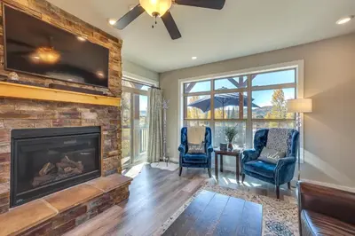 a living room with a fireplace and a tv at 4 Mi to Granby Ranch Home with Mtn Views in Granby