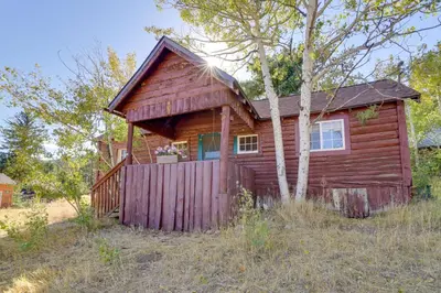 a small wooden cabin in the middle of a field at Hiawatha Peaceful Living in Rocky Mtn Natl Park in Allenspark