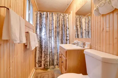 a bathroom with a toilet and a sink at Hiawatha Peaceful Living in Rocky Mtn Natl Park in Allenspark