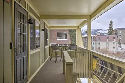 a balcony with a table and chairs on it at Condo on Fraser River Less Than 4 Mi to Winter Park Resort in Winter Park