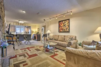 a living room with a couch and a table at Condo on Fraser River Less Than 4 Mi to Winter Park Resort in Winter Park