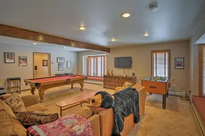 a living room with a pool table in it at Luxurious Grand Lake Vacation Rental with Hot Tub! in Grand Lake