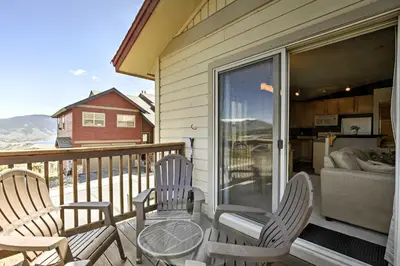 a porch with chairs and a table and a couch at Newly Remodeled Mtn-View Condo in Silverthorne in Silverthorne
