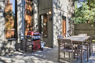 a patio with a table and chairs and a grill at Winter Park Cabin - Walk to Main Street and Downtown in Winter Park