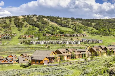 an aerial view of a village with houses on a hill at Ski, Soak and Explore! Granby Getaway with Mtn Views in Granby