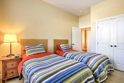 two beds sitting next to each other in a room at Ski-InandSki-Out Access Mtn-View Granby Condo! in Granby