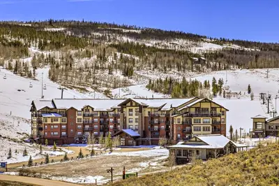 a hotel on a hill with snow on it at Ski-InandSki-Out Access Mtn-View Granby Condo! in Granby