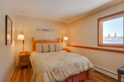 a bedroom with a bed and a window at Silverthorne Condo Patio, Mtn Views, Pool Access! in Silverthorne