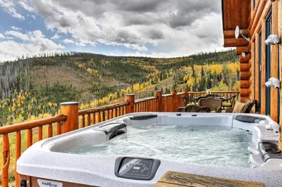 a hot tub on the deck of a cabin at 7 Mi to Granby Ranch Secluded Cabin with Mtn Views! in Granby