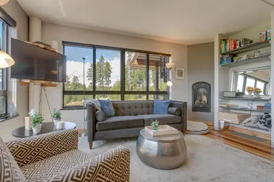 a living room with a couch and a tv at Fraser House with Mtn Views Near Winter Park! in Fraser