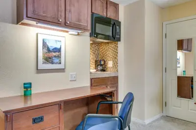 a kitchen with a desk and a chair at Half-Mi to Light Rail Greenwood Village Studio in Englewood
