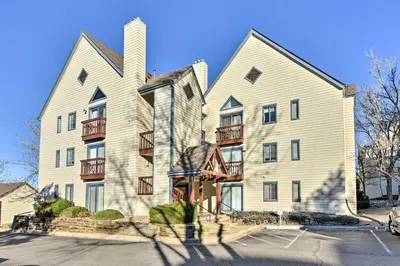 a large white building with balconies on it at Half-Mi to Light Rail Greenwood Village Studio in Englewood