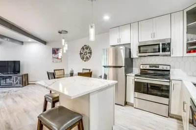 a kitchen with white cabinets and a counter top at Pet-Friendly Apt with Views 6 Mi to Keystone Resort in Silverthorne