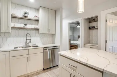 a kitchen with white cabinets and a sink at Pet-Friendly Apt with Views 6 Mi to Keystone Resort in Silverthorne