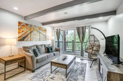 a living room with a couch and a tv at Pet-Friendly Apt with Views 6 Mi to Keystone Resort in Silverthorne