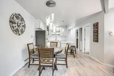 a kitchen and dining room with a table and chairs at Pet-Friendly Apt with Views 6 Mi to Keystone Resort in Silverthorne