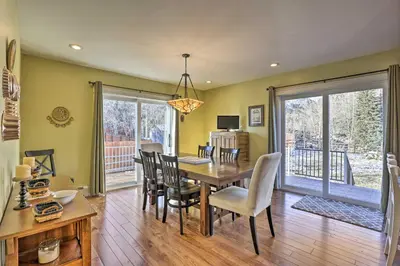 a dining room with a table and chairs at Mtn-View Home with Deck Walk to Dtwn Frisco! in Frisco