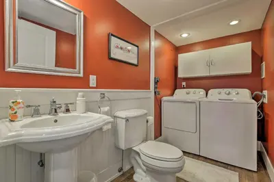 a bathroom with a white toilet and a sink at Mtn-View Home with Deck Walk to Dtwn Frisco! in Frisco