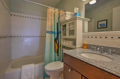 a bathroom with a sink and a toilet and a tub at Mtn-View Home with Deck Walk to Dtwn Frisco! in Frisco