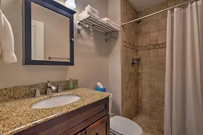 a bathroom with a sink and a shower and a toilet at Mtn-View Home with Deck Walk to Dtwn Frisco! in Frisco