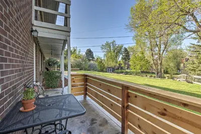 a patio with a table and a fence at 11 Mi to Denver Zoo Lakewood Studio with Fire Pit! in Lakewood