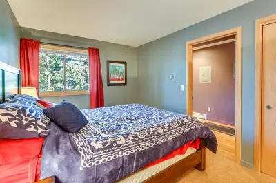 a bedroom with a bed and a window at Stunning Mountain Views Silverthorne Condo! in Silverthorne