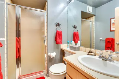 a bathroom with a shower and a toilet and a sink at Stunning Mountain Views Silverthorne Condo! in Silverthorne