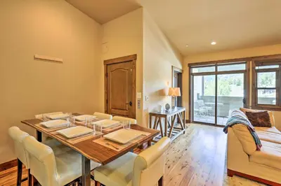 a dining room with a table and chairs at Elegant Frisco Condo with Private Hot Tub and Views! in Frisco