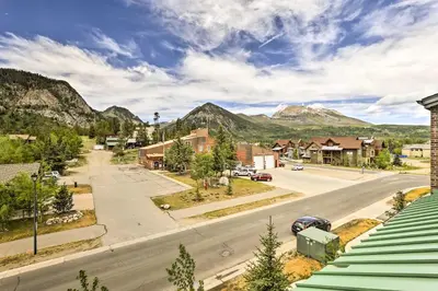 a view of a town with mountains in the background at Elegant Frisco Condo with Private Hot Tub and Views! in Frisco