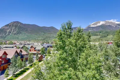 a view of a town with mountains in the background at 360 Mtn Views and Shared Hot Tub Cozy Frisco Condo! in Frisco