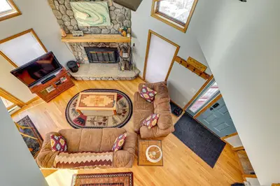 an overhead view of a living room with couches and a fireplace at 10 Mi to Keystone Resort Cabin with Private Hot Tub in Silverthorne