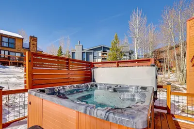 a jacuzzi tub on the balcony of a house at 10 Mi to Keystone Resort Cabin with Private Hot Tub in Silverthorne
