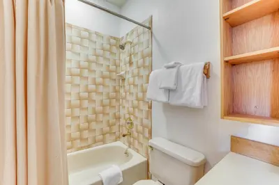 a bathroom with a tub and a toilet and a sink at Mtn-View Gem with Community Perks in Silverthorne! in Silverthorne